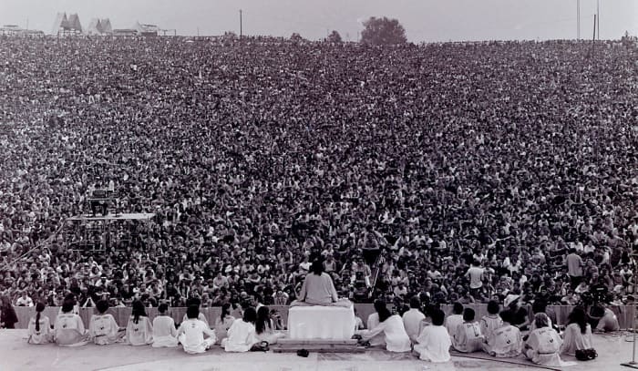 Opening ceremony at Woodstock. Swami Satchidananda speaking.