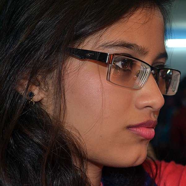 Bangladeshi woman wearing glasses--this Non-Working Eyeglasses thing is now going global.