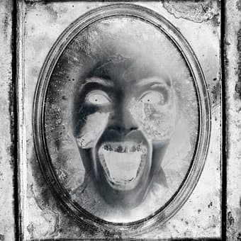 Antique mirrors are objects to approach with care. One can never know what events from the past might be trapped behind the glass.