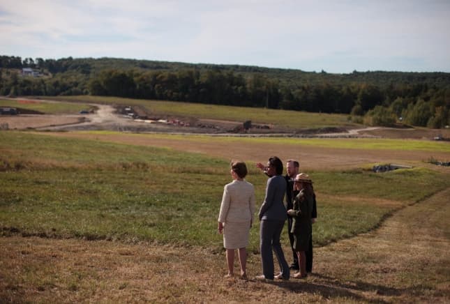 Former First Ladies Michelle Obama and Laura Bush survey the site of the Flight 93 airplane crash in Stonycreek Township, Pennsylvania, September 11, 2010.