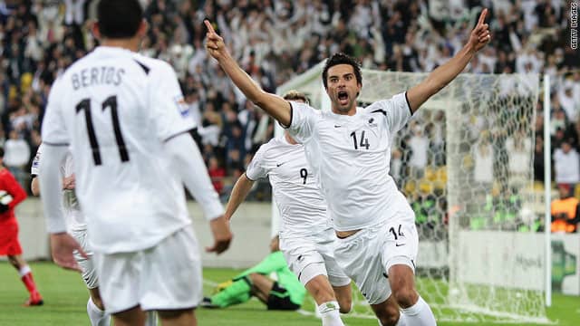 Rory Fallon (14) of New Zealand celebrates with teammates after scoring the decisive goal for New Zealand in a World Cup playoff against Bahrain.