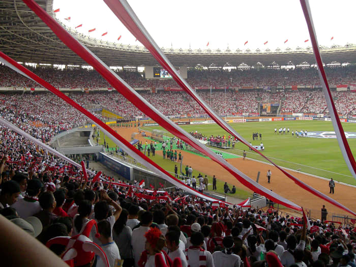 Fans at Gelora Bung Karno Stadium watch as Indonesia hosts South Korea during a 2007 Asian Cup group stage match.