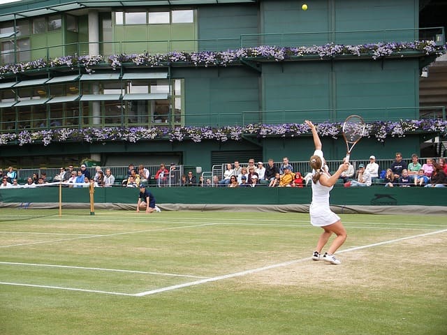 Simona Halep serving. The Romanian professional has scrappy style and describes herself as "an aggressive baseliner." She is an excellent counterpuncher and very athletic on court.