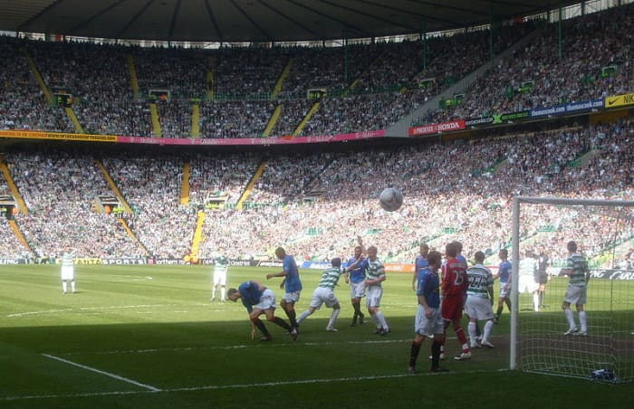 A photo showing an Old Firm match from 2008 at Celtic Park. Celtic are in green, Rangers are in blue.