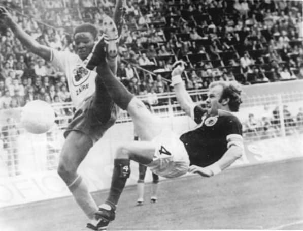 A photo of Scotland's Billy Bremner challenging for the ball in a match against Zaire in the 1974 FIFA World Cup.