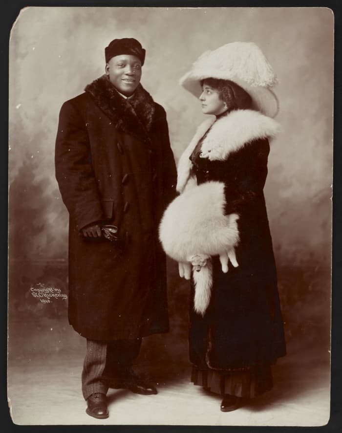 Boxing Champion and his wealthy wife pose for the cameras.
