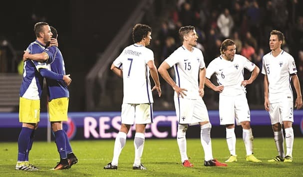 Finland's players (white) stand dejected following the conclusion of its opening 2018 FIFA World Cup qualifier on Sept. 3, 2016. Finland managed a 1-1 draw against Kosovo, who made its World Cup qualifying debut.