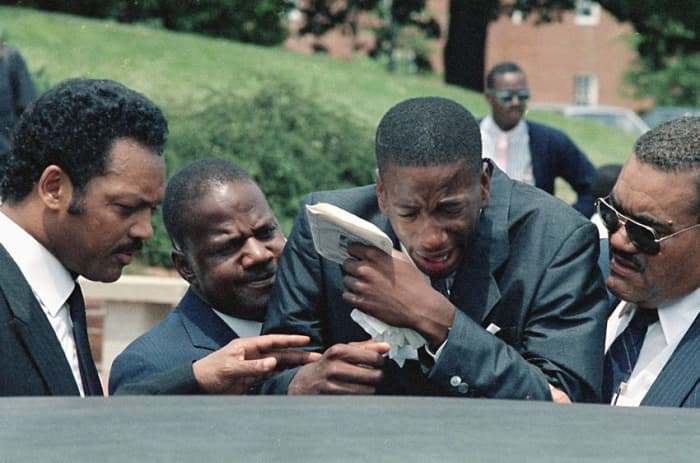 Len's brother Jay being consoled by Jesse Jackson (far left) and his father James (2nd left) Jay would be murdered 5 years later.