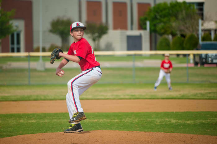Cooperstown Dreams Park provides each player with a home and away jersey (red for home and navy blue for away), hat, red and navy socks, long and short-sleeved mock t-shirts, and a windbreaker jacket.