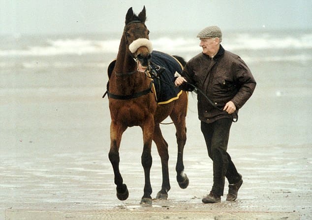 The famous racehorse Red Rum, who was owned by Noel Le Mere, is exercised on the beach by his late trainer Ginger McCain.