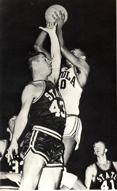 Loyola forward Vic Rouse skies for a rebound against Mississippi State in the 1963 NCAA Tournament.
