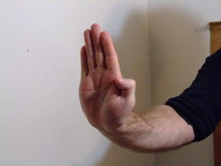 Practice with a palm at first. Even though it doesn't look much, palm strikes can be very effective.
