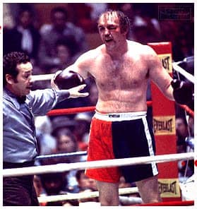 The Bayonne Bleeder fought with a lot of pride... and a lot of blood in his fights. He's trying to wave off referee, Tony Perez who has just stopped the bout.