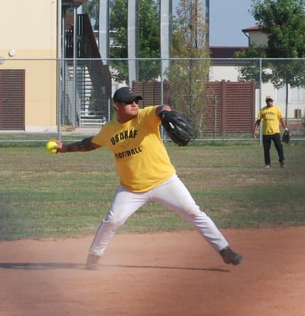 Note how the man has stepped forward with his opposite foot and is beginning to move his hips to the front, drawing his throwing arm across his body horizontally; a professional throwing technique.