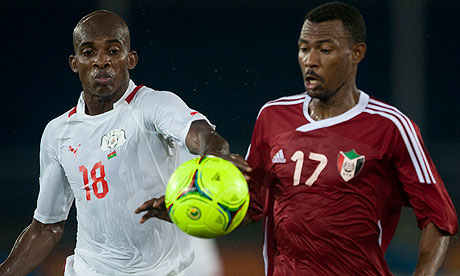 Sudan's Mudather El Tahir (17) battles for possession with Burkina Faso's Charles Kabore in a 2012 AFCON group stage match.