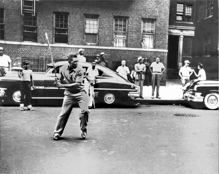 Willie playing stickball in Harlem, 1950s. I believe this is St. Nicholas Place, just up the street from the Polo Grounds.