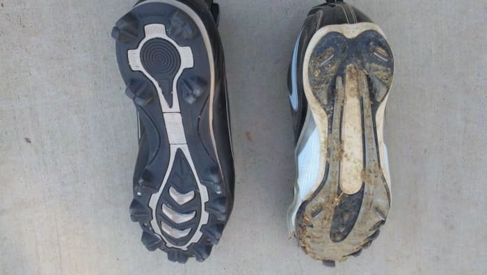 This photo shows the underside of a plastic/rubber cleat on the left and a metal cleat on the right.