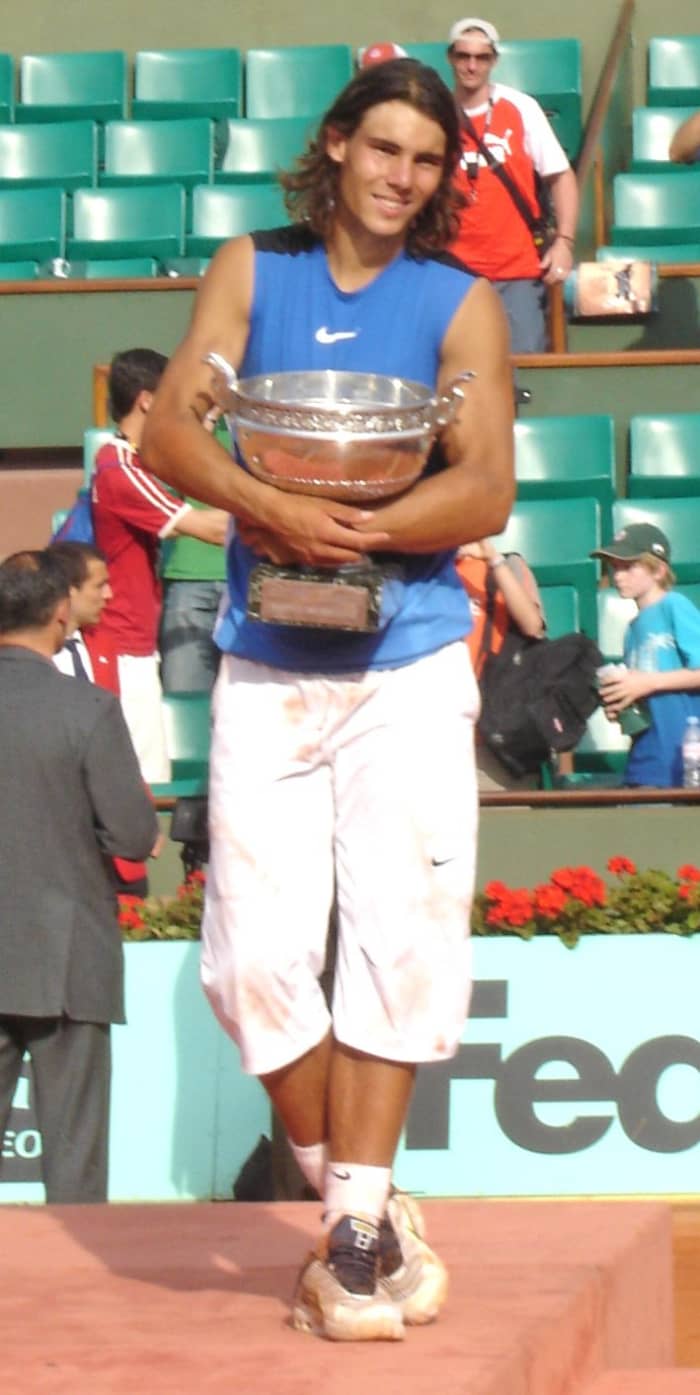 Rafael Nadal, seen here after winning the 2006 French Open tournament, has won the tournament a record nine times, including an Open Era record of five consecutive titles.