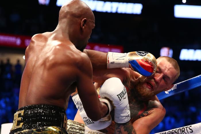 Notice Connor's lower hand holding back Floyd's. That is exactly what a trap looks like and both men used this technique.