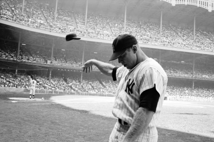 Iconic photo of Mickey tossing his helmet in disgust in '65 (Maris is on deck). After a decade of pain, frustration was showing.