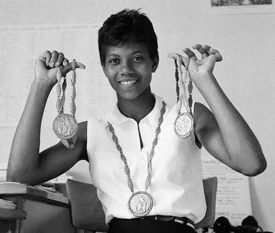 Wilma Rudolph showing her three Olympic gold medals.