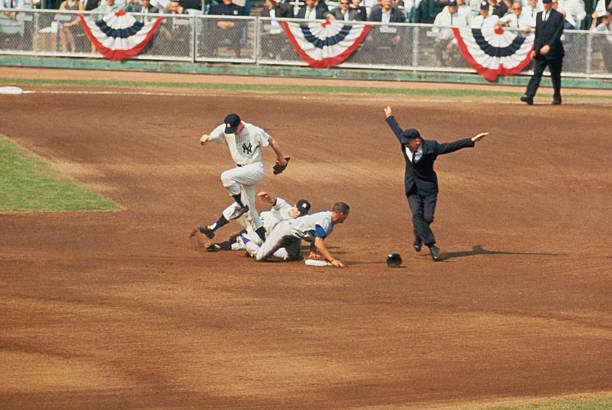 Wills slides in safe at second base after Al Downing's failed pick off attempt. Wills led the National League with 40 stolen bases. The year before he had set a record with 104. If he reached first, it was as good as a double.