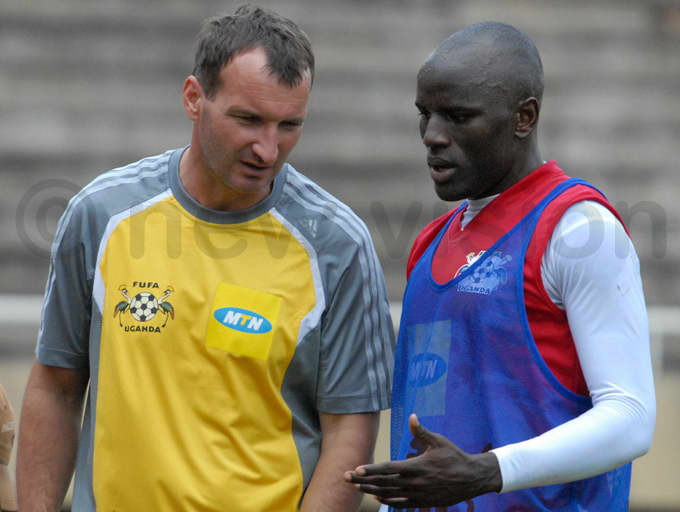 Czaba Laszlo (left) discusses footballing matters with Geoffrey Massa during a training session in 2008. Laszlo was one of three prominent coaches to help Uganda get back on the map.