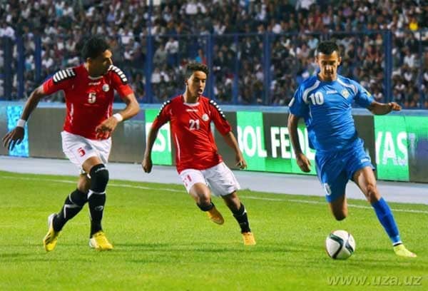 Abdulmuain Al-Jarshi (#5) and Ahmed Al-Sarori (#21) chase Uzbekistan's Sardor Rashidovb (#10) during a qualifier against Uzbekistan at Pakhator Central Stadium in Tashkent, Uzbekistan on Sept. 3, 2015.
