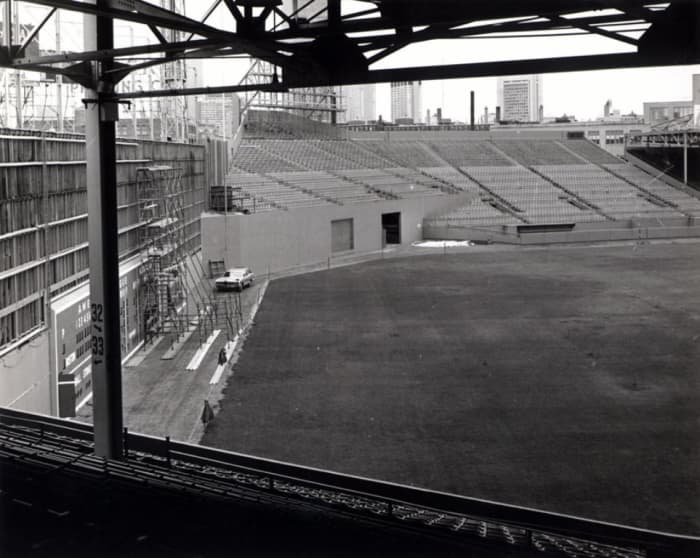 The Green Monster getting a makeover after the World Series. It's 37 feet high and only 310 feet from home plate. NBC placed a cameraman just above the stanchion to the left.
