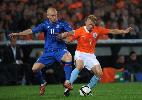 Iceland's Emil Hallfredsson battles with the Netherlands' Dirk Kuyt during a 2010 FIFA World Cup qualification match in Rotterdam, Netherlands. Iceland lost the match 2-0, one of five it suffered in the five-team group
