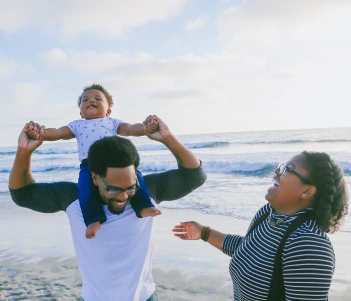 "You're on Daddy's shoulders, wow! You're having a great time at the beach!" Try using parallel talk or self-talk to give your child more exposure to words.