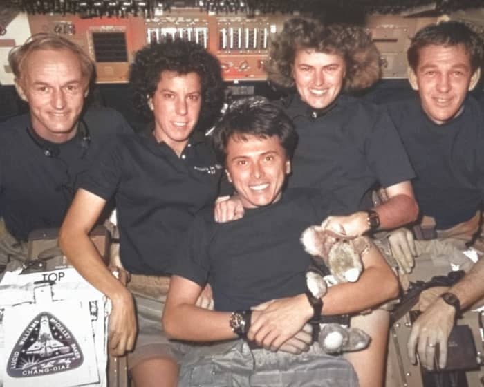 Colorize Photo attempted to color only these astronauts' skin and hair, and it skipped everything else entirely, including one of the subjects' hands.