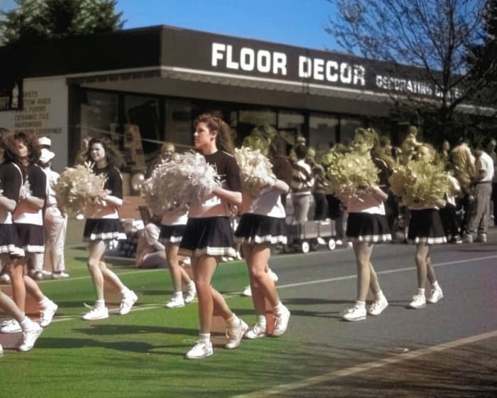 The AI tried with this photo, it really did! It appropriately colorized some of the cheerleaders' faces and legs, but missed others. Also, it had trouble distinguishing the pavement from grass, and started to color it green, but didn't finish the job