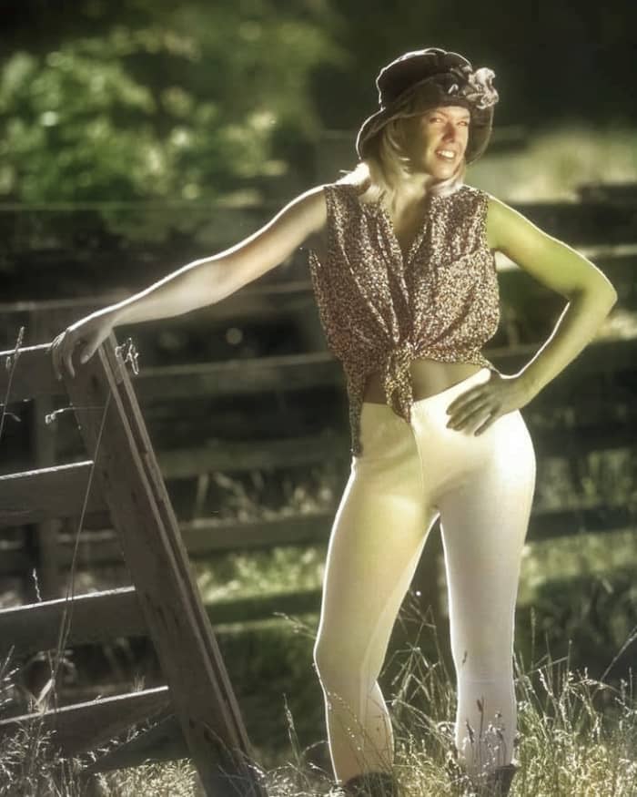 Similarly, the AI made this young lady's arms green. Perhaps it confused them with the background foliage.