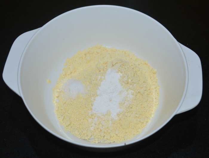 Step one: In a mixing bowl, add gram flour, rice flour, and salt. Mix well.