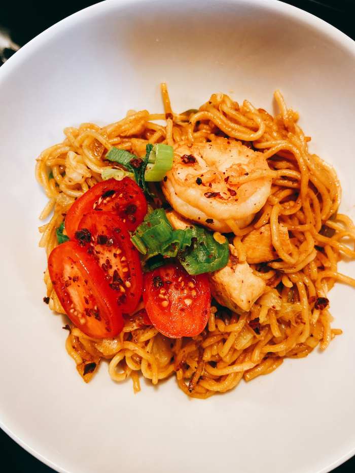 Serve the fried noodles immediately. It is best enjoyed while still hot.