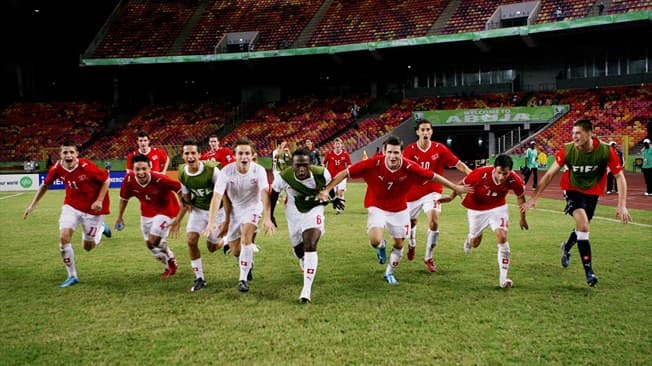 Swiss players celebrate after winning its match against Brazil 1-0 as Switzerland won all three games in the group stage.