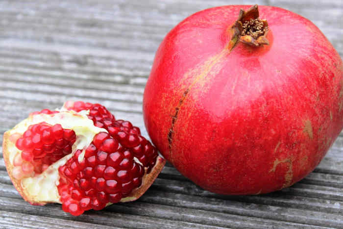 Whole pomegranate and seeds