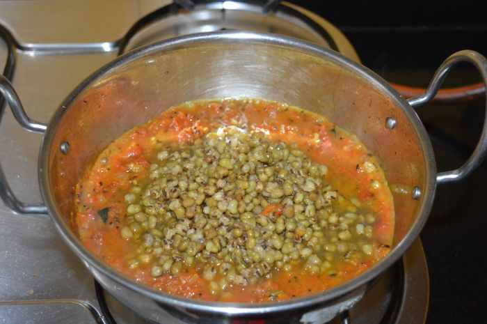 Step five: Add cooked green gram along with its water.