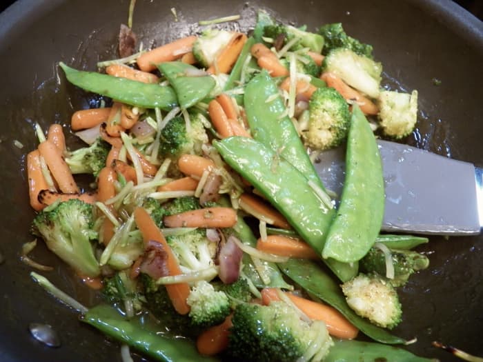 Add vegetables and chicken to the sauce and heat. Serve with rice or noodles on the side.