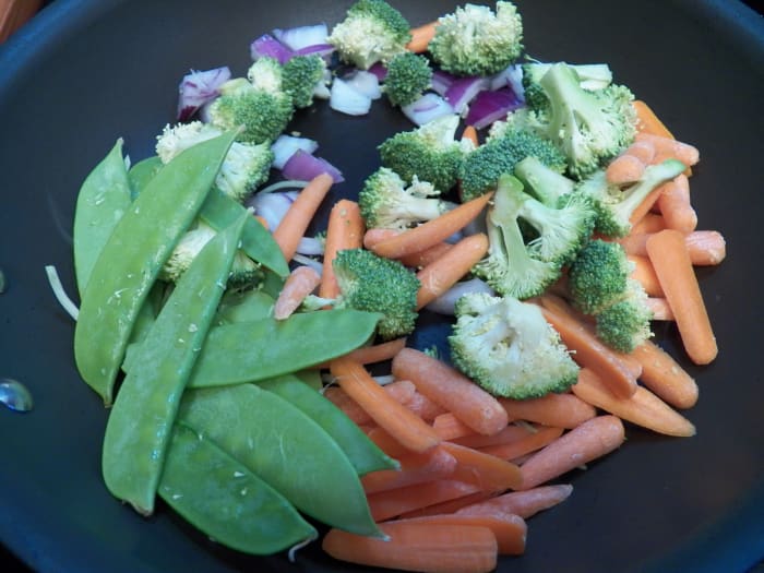 Cut up packaged Chinese vegetables so the pieces are the same size.