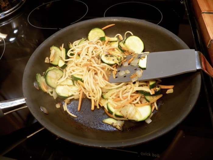 Chop vegetables like zucchini, onions, and carrots and stir-fry in a pan with a teaspoon of oil for about 5 minutes or until slightly soft. Add already-cooked pasta or noodles. Stir until hot through. Add cooked chicken or beef and 1/4 cup sauce.