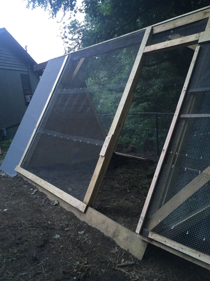 I rolled hardware cloth out in rows and attached them together with zip ties. I also secured the edges of the hardware cloth to the pen with 2x4s. A roll of roofing was put over the "A" shaped house roof.