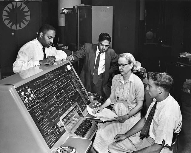Grace Murray Hopper sits at the UNIVAC I in 1960. She was an American mathematician and became Rear Admiral in the U.S. Navy as a pioneer in developing computer technology.