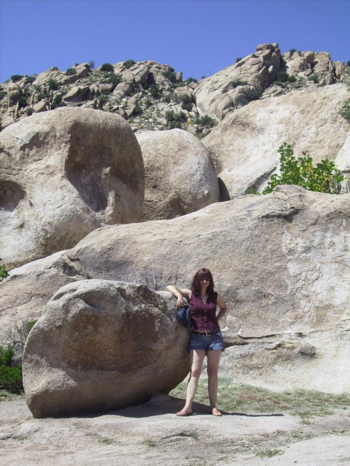 My wife waits below as I climb the boulders in the Texas Canyon Rest Stop along Interstate-10 in southern Arizona.