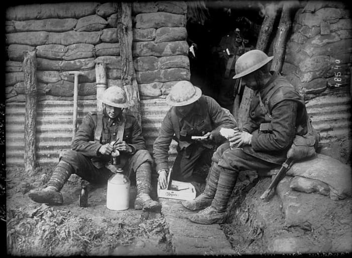 Canadian soldiers manage to get a break and relax for a while in the trenches.