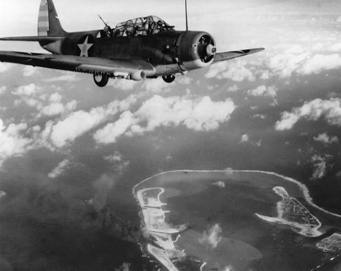 A Douglas TBD-1 Torpedo plane from the aircraft carrier USS Enterprise over Wake Island