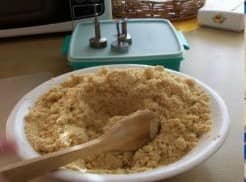 Remove the pan from the heat and transfer the mixture on a big bowl. Then add the powdered milk, toss for another 3-4 minutes. Add sugar and melted butter. Mix well.