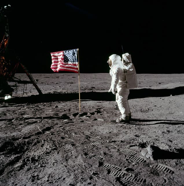 Buzz Aldrin on the moon in 1969 with Apollo 11. Aldrin is a symbol of the ongoing public and private Mission to Mars.