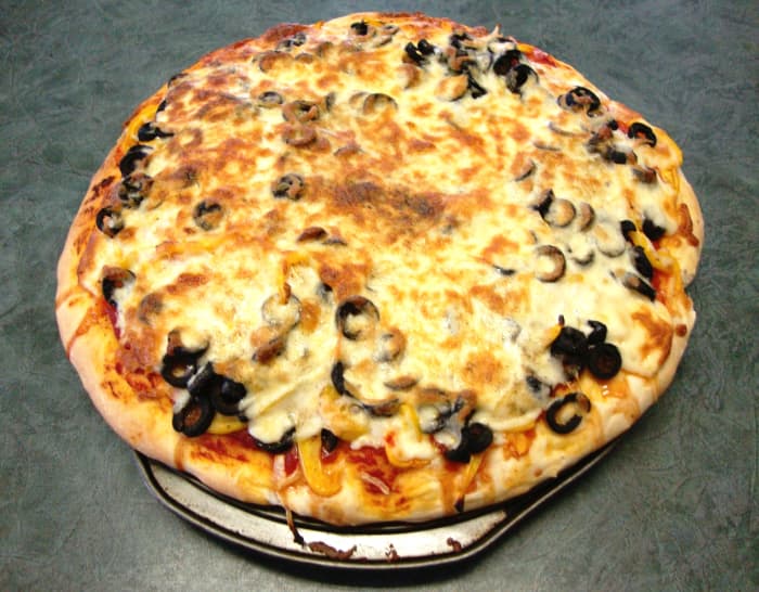 A thick, tender pizza smothered in Mozza, onions, red and yellow peppers and black olives.